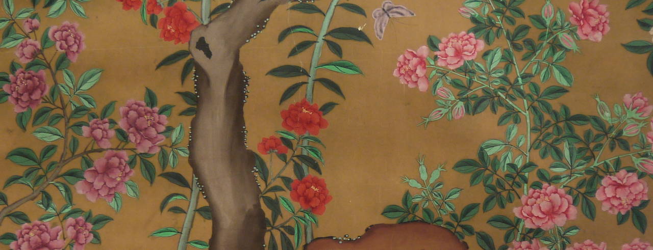 A beautiful hand-painted section of 19th century Chinese wallpaper, with a bird, butterfly and vibrantly colored flowers on a rich coffee background.

This panel is in restored condition, and has been mounted on muslin. It is unframed.