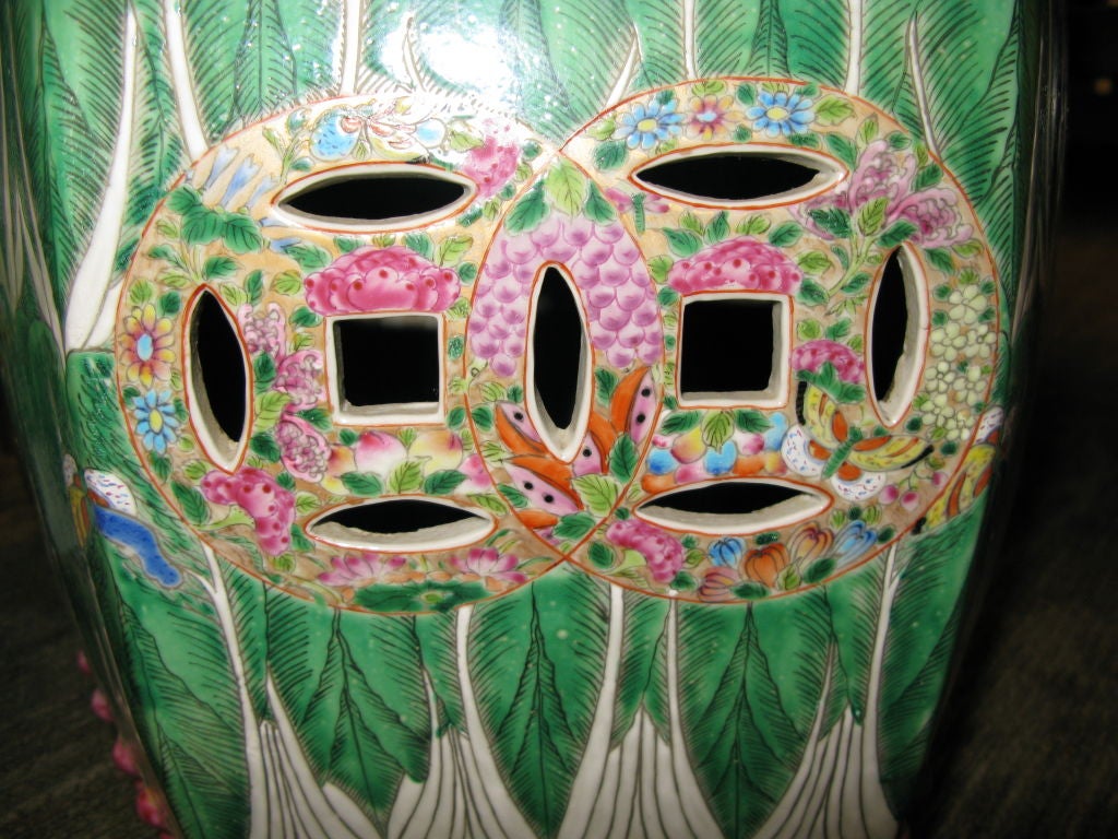 A pair of Chinese hexagonal garden seats with design of cabbage leaves, and wide borders of flowers and butterflies.