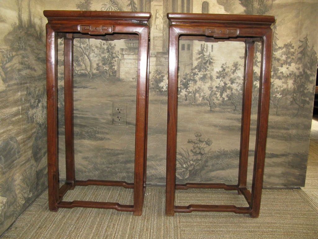 Pair of 19th century pedestal tables.<br />
<br />
Hongmu wood.<br />
<br />
Simple, carved apron, with stretchers at base.