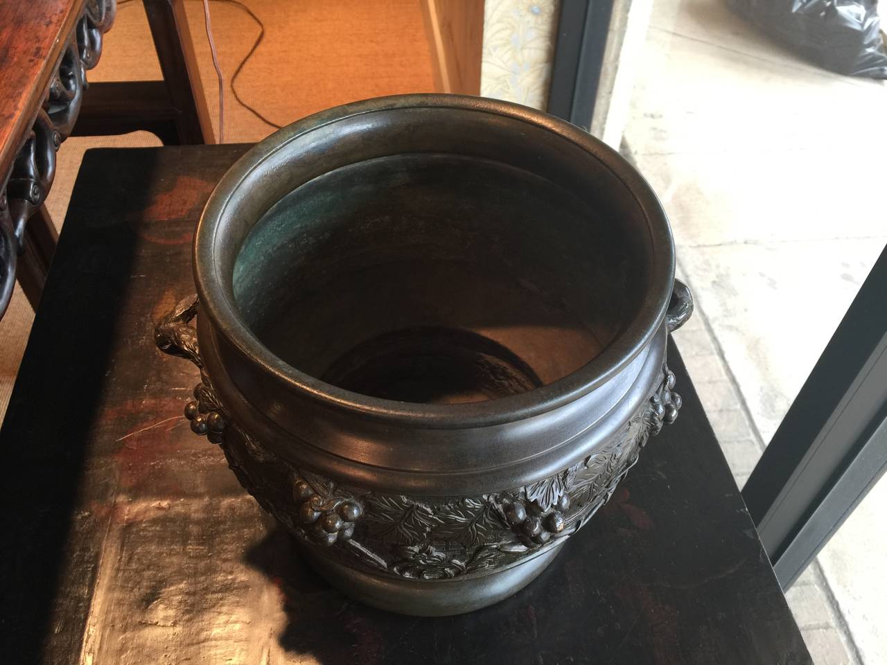 19th century bronze Japanese planter with handles, and raised grapevine design.