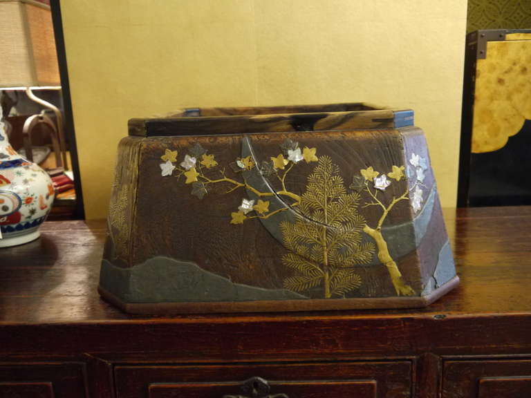 A gorgeous, large eight sided hibachi, 

19th century.

This piece is wood, with a copper liner. The exterior design had moon, stream and trees in silver and gold lacquer, with some inlaid mother-of-pearl.