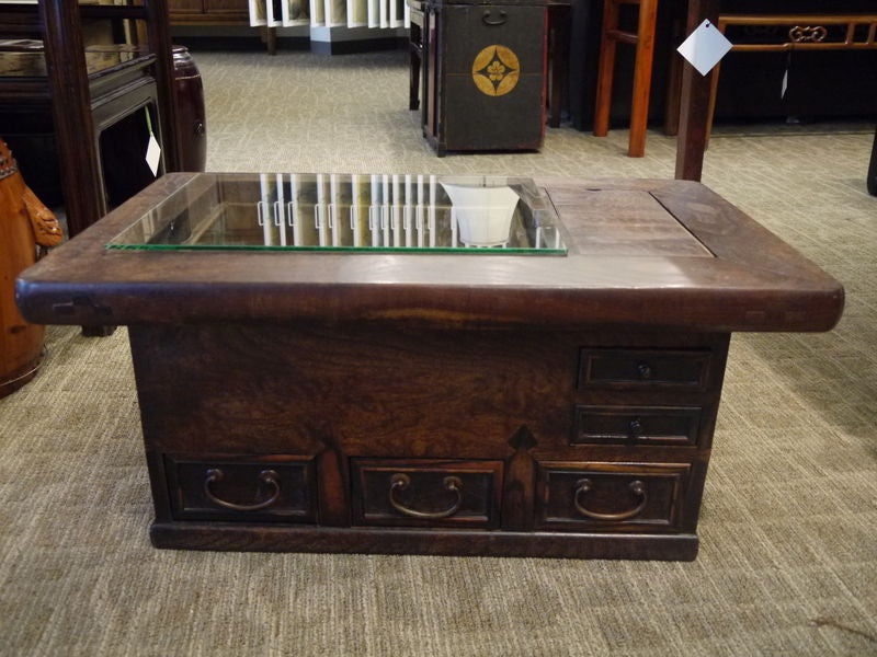 Large wooden antique Japanese hibachi with drawers and large inset area lined in copper.<br />
<br />
With glass top, and can be used as a coffee table.