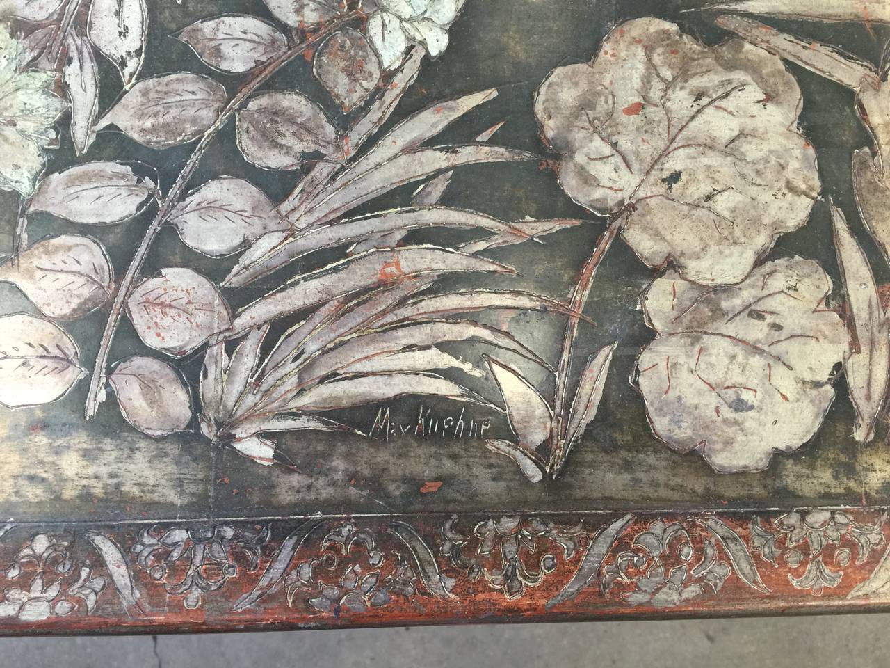 A stunning table by Max Kuehne (1880-1668), with incised floral design and intricate borders on silver leaf over gesso.

Table, circa 1950.

Signed on the top (see close up image) Max Kuehne.