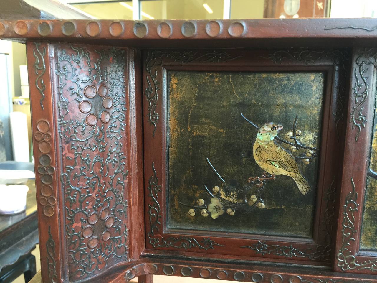 A beautiful antique Japanese lacquer cabinet with open shelves, doors and drawers.  The design on each panel is unique, and includes a tiger in a bamboo grove, geese, herons, figures and birds.

There is handpainted lacquer as well as mother of