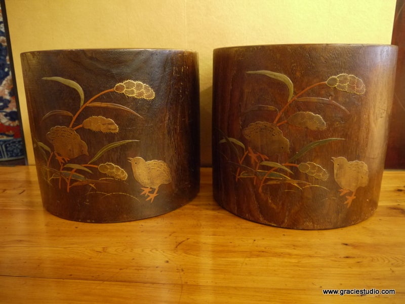 A pair of Japanese wood hibachis, with copper liners.

Design of vines, chicks and wheat on exterior.