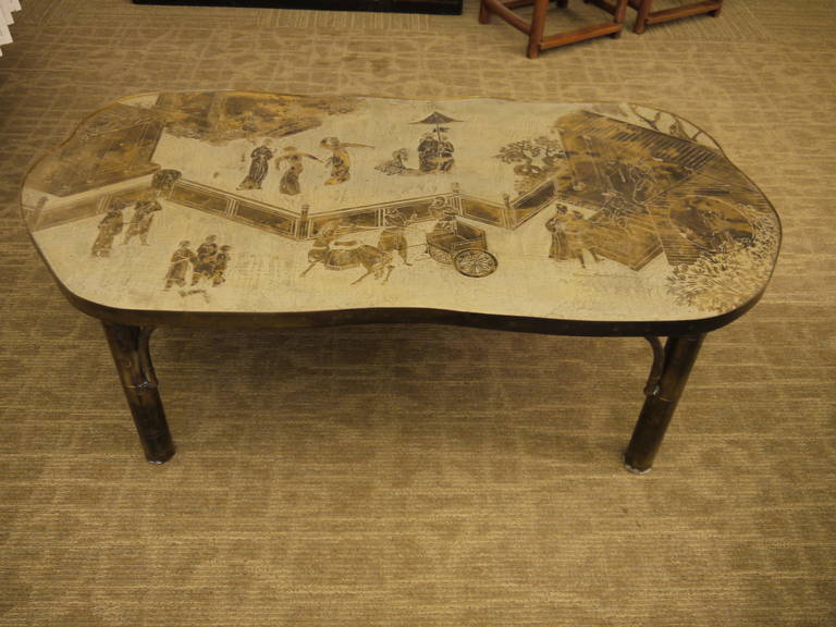 Circa 1970s table by Philip and Kelvin LaVerne, signed on top.

This table has a beautiful, organic shape to the top, and stylized bamboo legs.

The top features a Chinoiserie landscape and figure design, with walled gardens, buildings, people