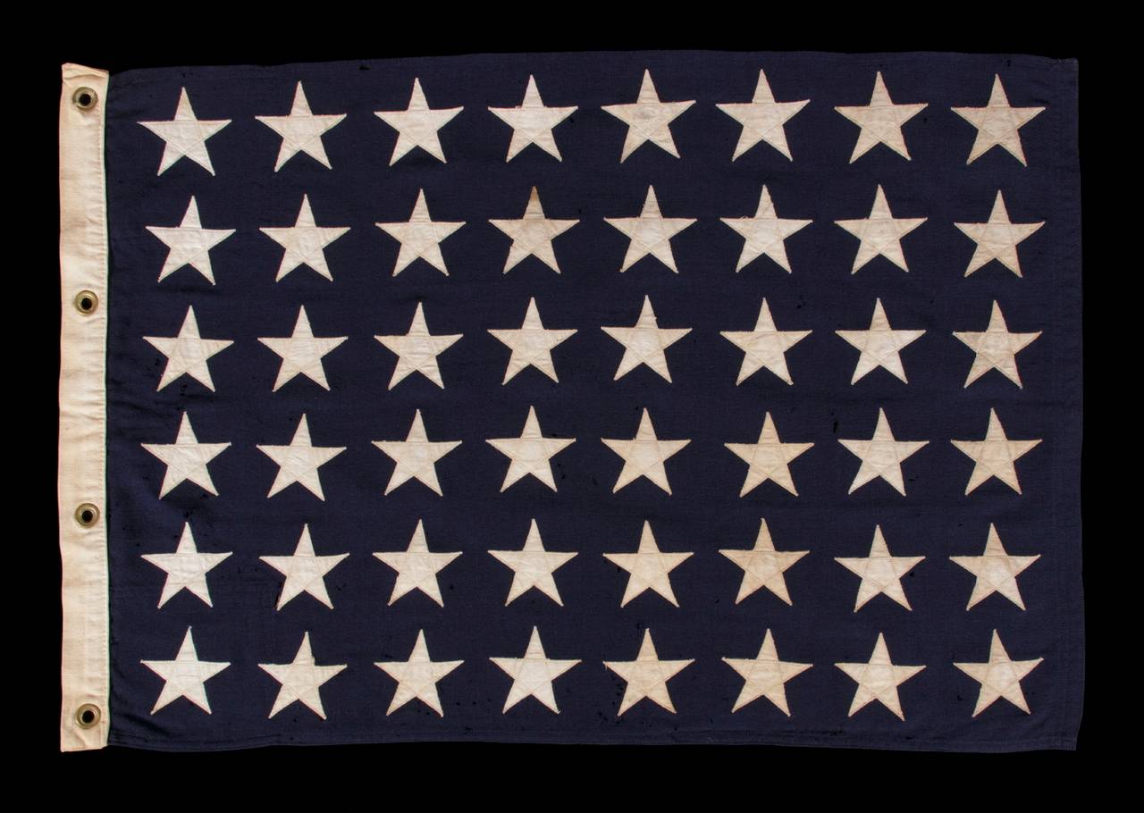 48 STAR U.S. NAVY JACK, WWI - WWII ERA (1917-1945): 

 United States Navy jack with 48 stars, made in the period between WWI (U.S. involvement 1917-18) and WWII (U.S. involvement 1941-45). Like the British Royal Navy, American vessels flew three