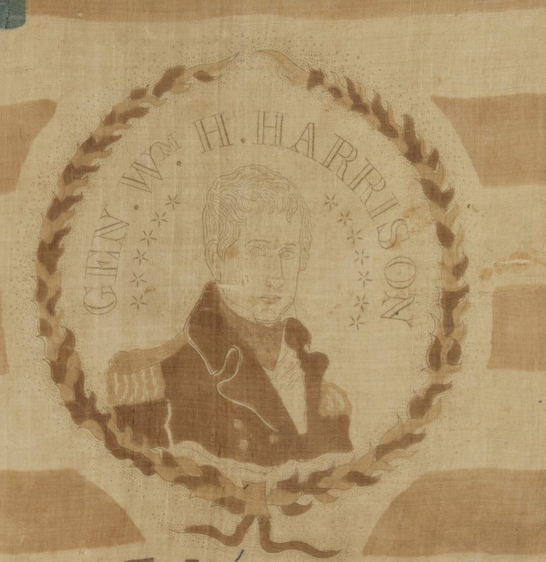 THE FIRST YEAR FOR POLITICAL CAMPAIGN PARADE FLAGS:
A RARE EXAMPLE FROM THE 1840 PRESIDENTIAL CAMPAIGN OF WILLIAM HENRY HARRISON, WITH 13 STARS IN A 3rd MARYLAND PATTERN AND A FOLK PORTRAIT OF “OLD TIPPECANOE” IN MILITARY GARB:

13 star American