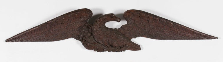 EXPERTLY CARVED, SOLID WALNUT, AMERICAN EAGLE WITH BEAUTIFUL STYLE, LARGE SCALE & EXCEPTIONAL EARLY SURFACE, ca 1830-1860, PROBABLY OF PENNSYLVANIA ORIGIN:

Elegant form, expert carving, and an early date are not the only attributes worthy of