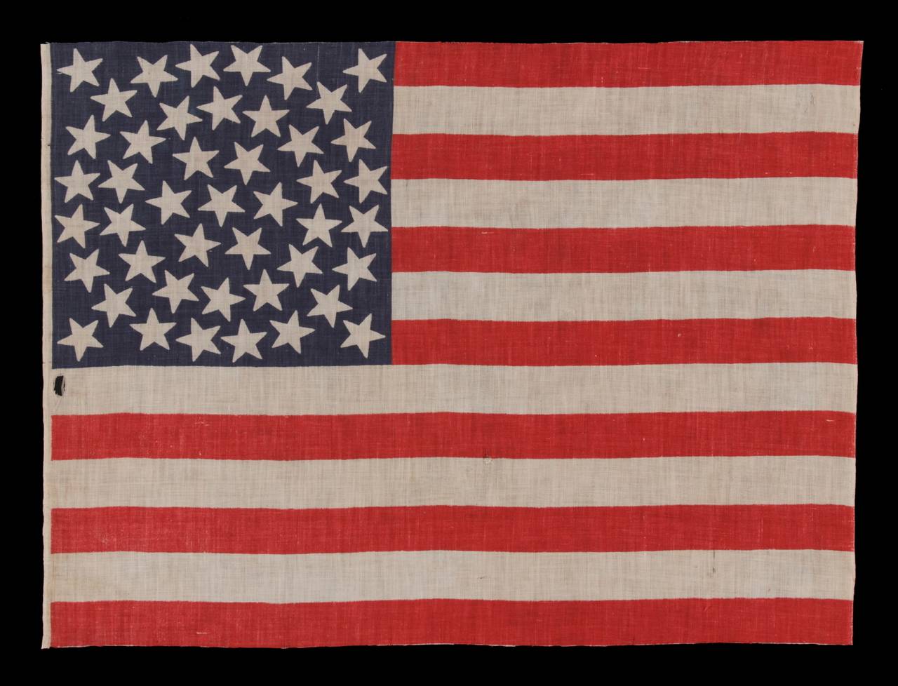 45 stars in a medallion configuration, a rare feature in this period, 1896-1908, Utah statehood:

45 stars American parade flag, printed on cotton bunting, with a beautiful, triple-wreath style medallion configuration of stars. This highly desired