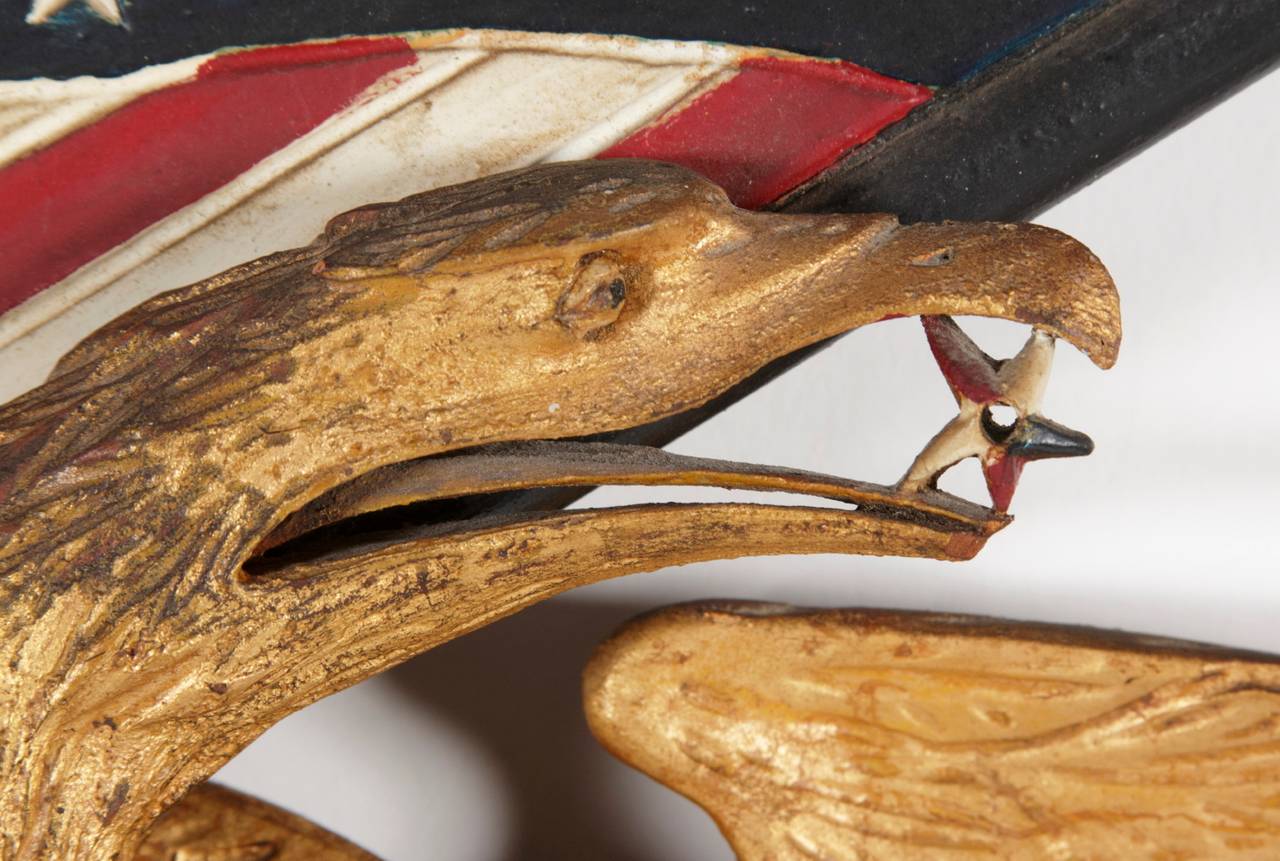 Carved eagle by George Stapf of Harrisburg, Pennsylvania, an unusually fine example with a star in its beak and a shield in relief on its breast with the word 