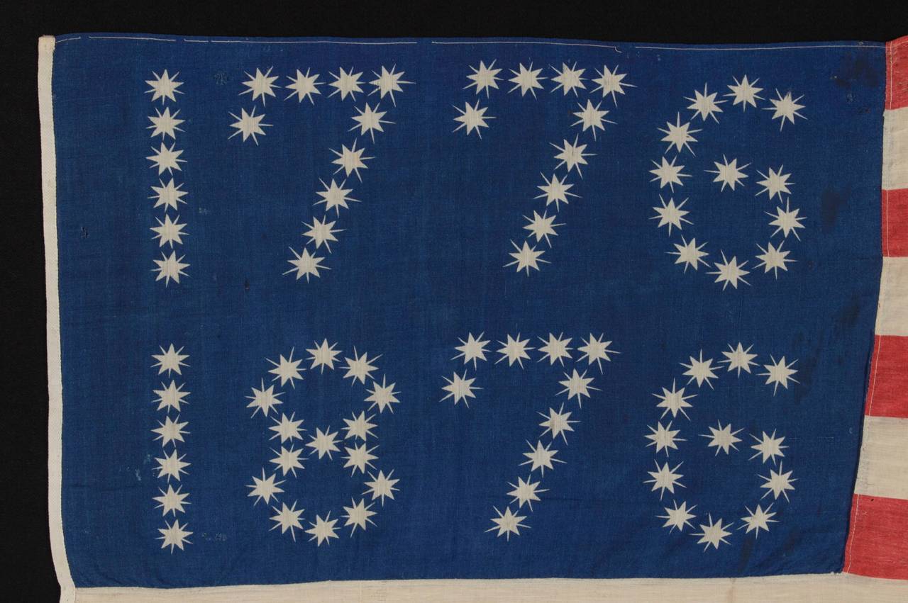 ANTIQUE AMERICAN FLAG WITH 10-POINTED STARS THAT SPELL 