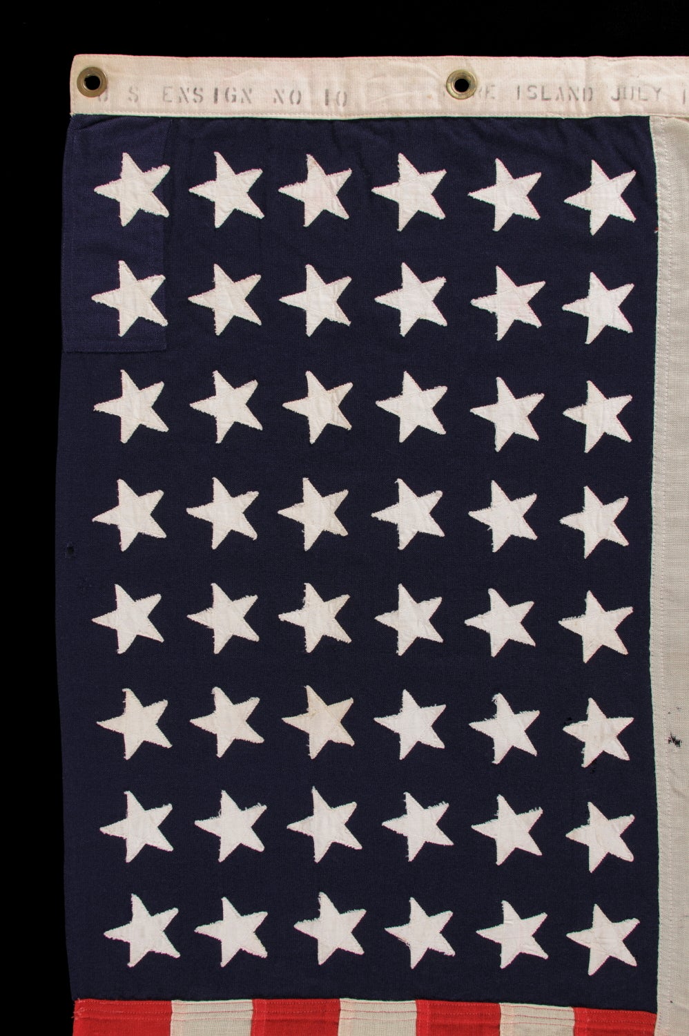 48 STAR, U.S. NAVY SMALL BOAT ENSIGN WITH AN ATTRACTIVE, ELONGATED FORMAT, MADE AT MARE ISLAND, CALIFORNIA DURING WWII, SIGNED AND DATED JULY, 1943:

48 star American national flag, made during World War II (U.S. involvement 1941-45) and signed