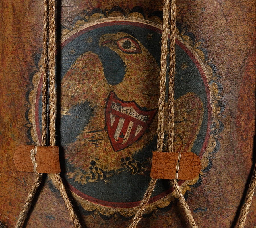 EARLY AMERICAN MILITIA DRUM WITH A DRAMATIC FOLK-STYLE EAGLE, 1812-1846: 

Pre-civil war American militia drum, circa 1812-1848 (war of 1812-Mexican war era) with a fantastic folk-style eagle in a red, white, and blue medallion with a black and gold