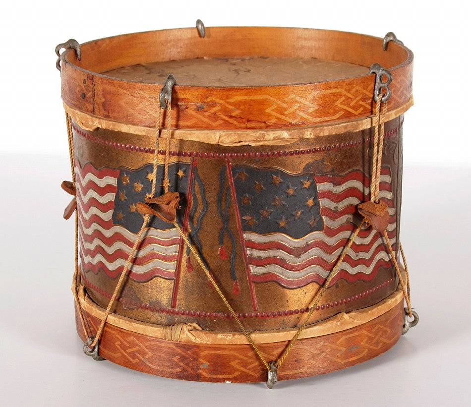 PATRIOTIC AMERICAN TOY DRUM WITH OPPOSING FLAGS, PROBABLY SPANISH AMERICAN WAR ERA (1898):

This patriotic child's toy snare drum was made sometime between the 1876 centennial of American independence in 1876 and the Spanish-American War (1898).
