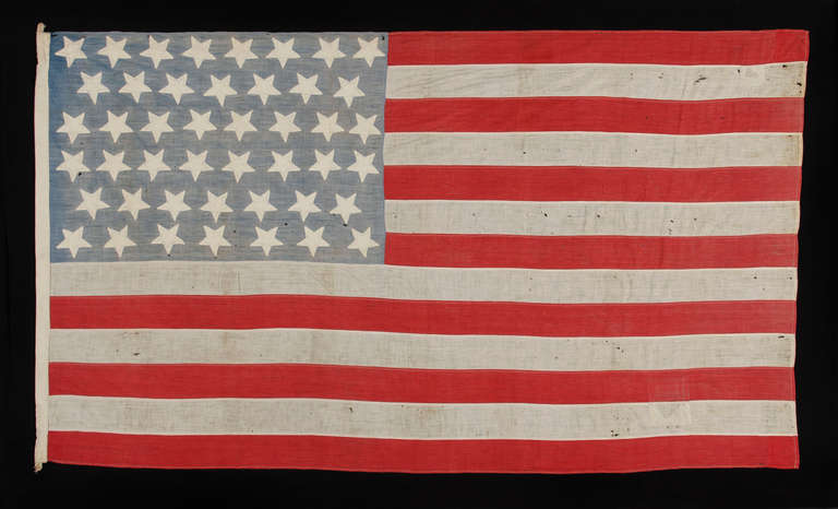 45 UNUSUAL STARS ON A HOMEMADE COTTON FLAG WITH A BEAUTIFULLY FADED CANTON, 1896-1907, SPANISH-AMERICAN WAR ERA, UTAH STATEHOOD:

45 star American national flag, made in the period between 1896 and 1907, with a pleasing presentation and some