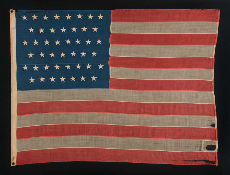 45 STARS ON AN ANTIQUE AMERICAN FLAG WITH A RICH INDIGO BLUE CANTON AND ATTRACTIVE WEAR, 1896-1907, SPANISH-AMERICAN WAR ERA, UTAH STATEHOOD:

45 star American national flag, made in the period between 1896 and 1907, with especially beautiful