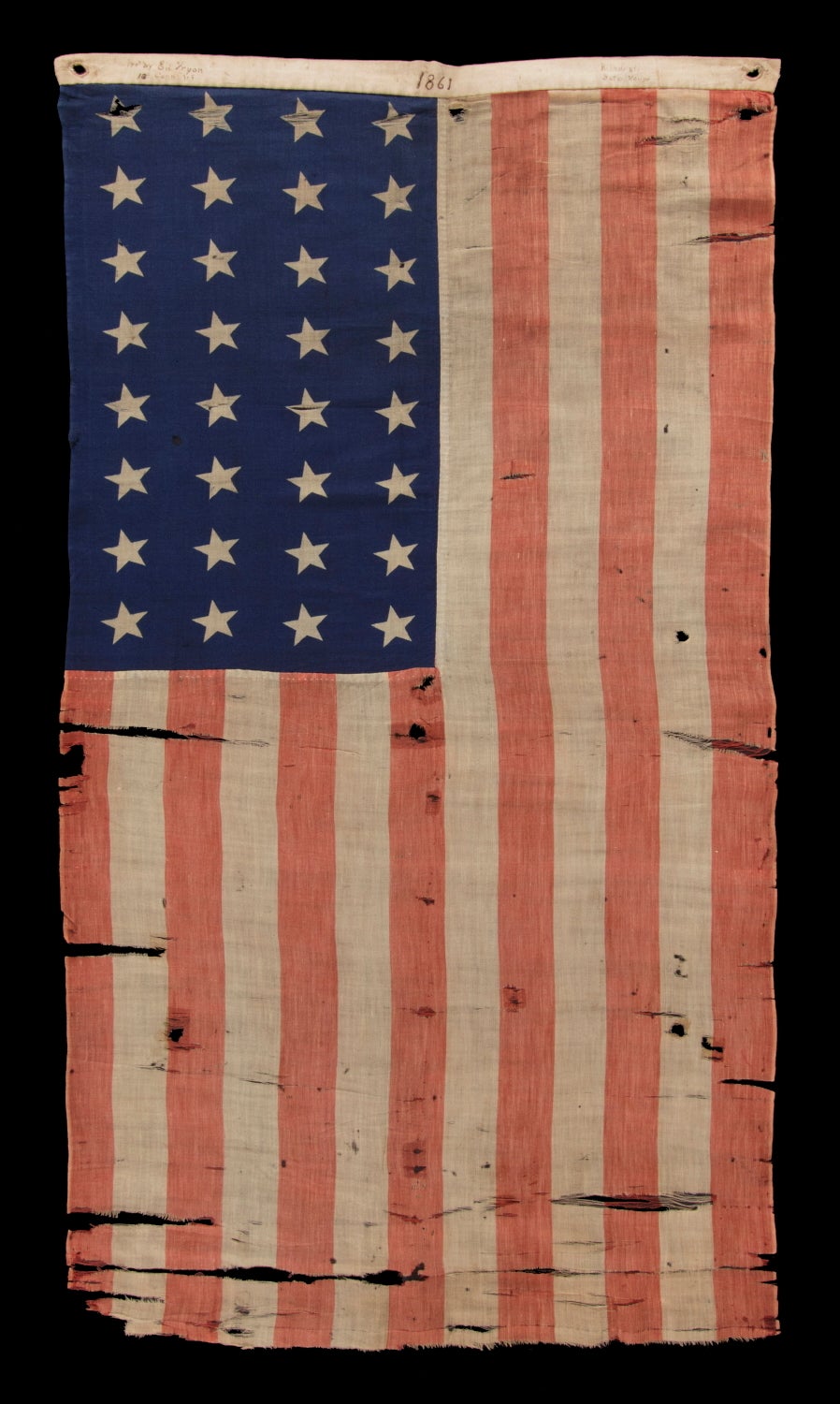 32 STARS (MINNESOTA STATEHOOD), 1858-59, PRESENTED BY A CIVIL WAR MUSICIAN WITH THE 13TH CONNECTICUT INFANTRY, AN UNUSUAL EXAMPLE WITH WOVEN STRIPES AND PRESS-DYED STARS, POSSIBLY MADE IN NEW YORK BY THE ANNIN COMPANY:

32 star American flags are