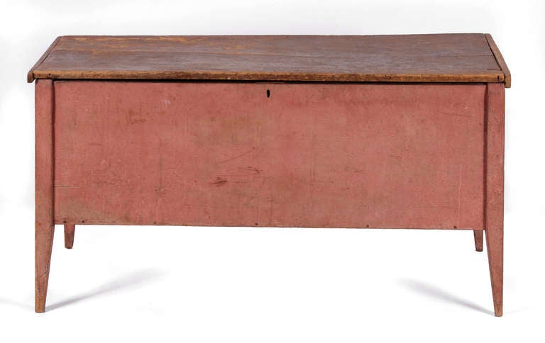 SOUTHERN BLANKET CHEST ON TALL, TAPERED LEGS, IN SALMON PAINT WITH EXCELLENT SURFACE, VIRGINIA / TENNESSEE / KENTUCKY REGION, 1830-50:

Southern blanket chest on mortised legs that taper at the bottom to finely pointed, country Hepplewhite feet. 