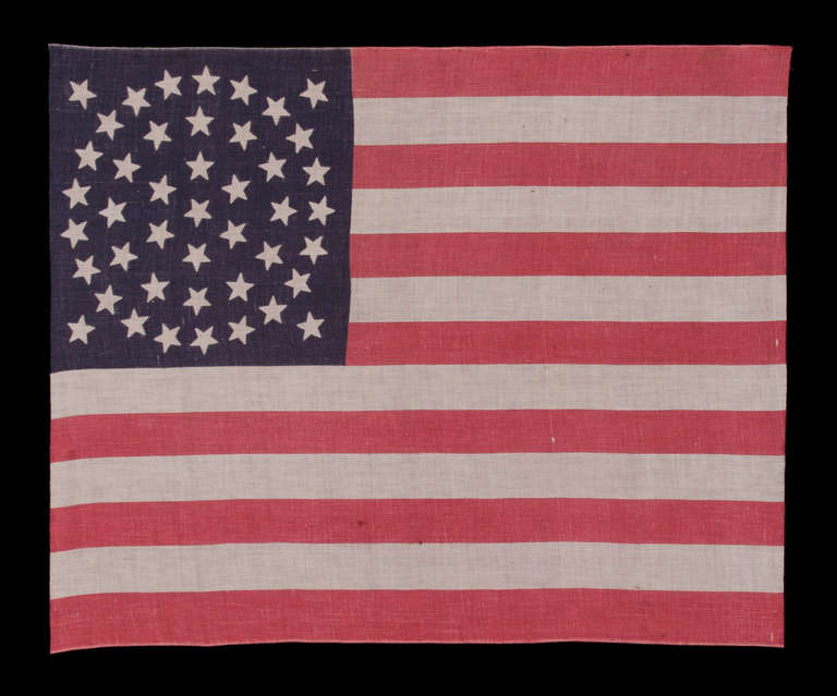 44 STARS ON A LARGE SCALE PARADE FLAG, WYOMING STATEHOOD, 1890-1896, RARE IN THIS PERIOD WITH A WREATH CONFIGURATION:

44 star American parade flag with triple wreath medallion star configuration, printed on cotton. This highly desired star
