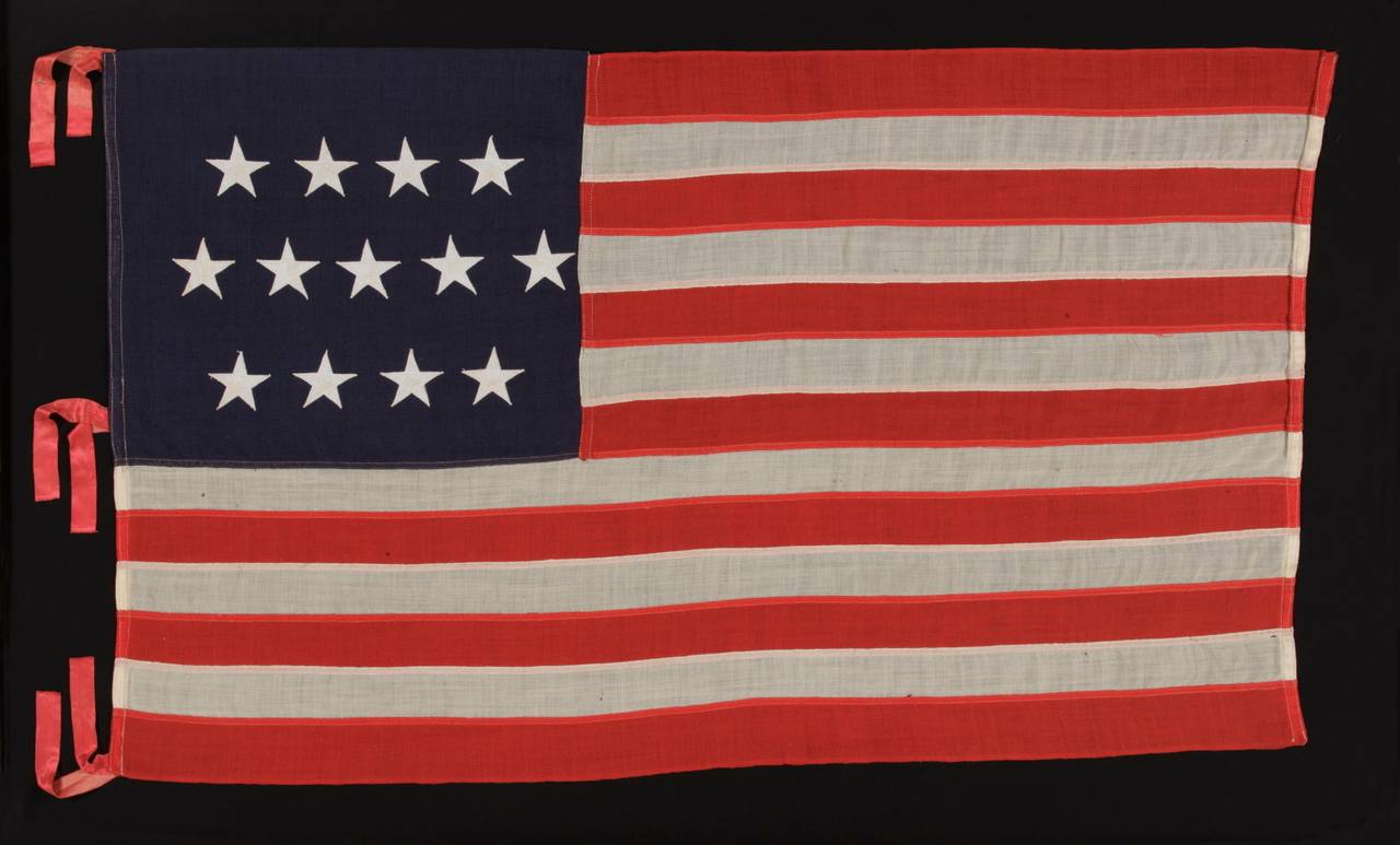 13 STARS ARRANGED IN A 4-5-4 PATTERN ON A SMALL-SCALE FLAG OF THE 1895-1910 ERA:

 13 star flag of the type made from roughly the last decade of the 19th century through the first quarter of the 20th century. The 4-5-4 lineal configuration is both