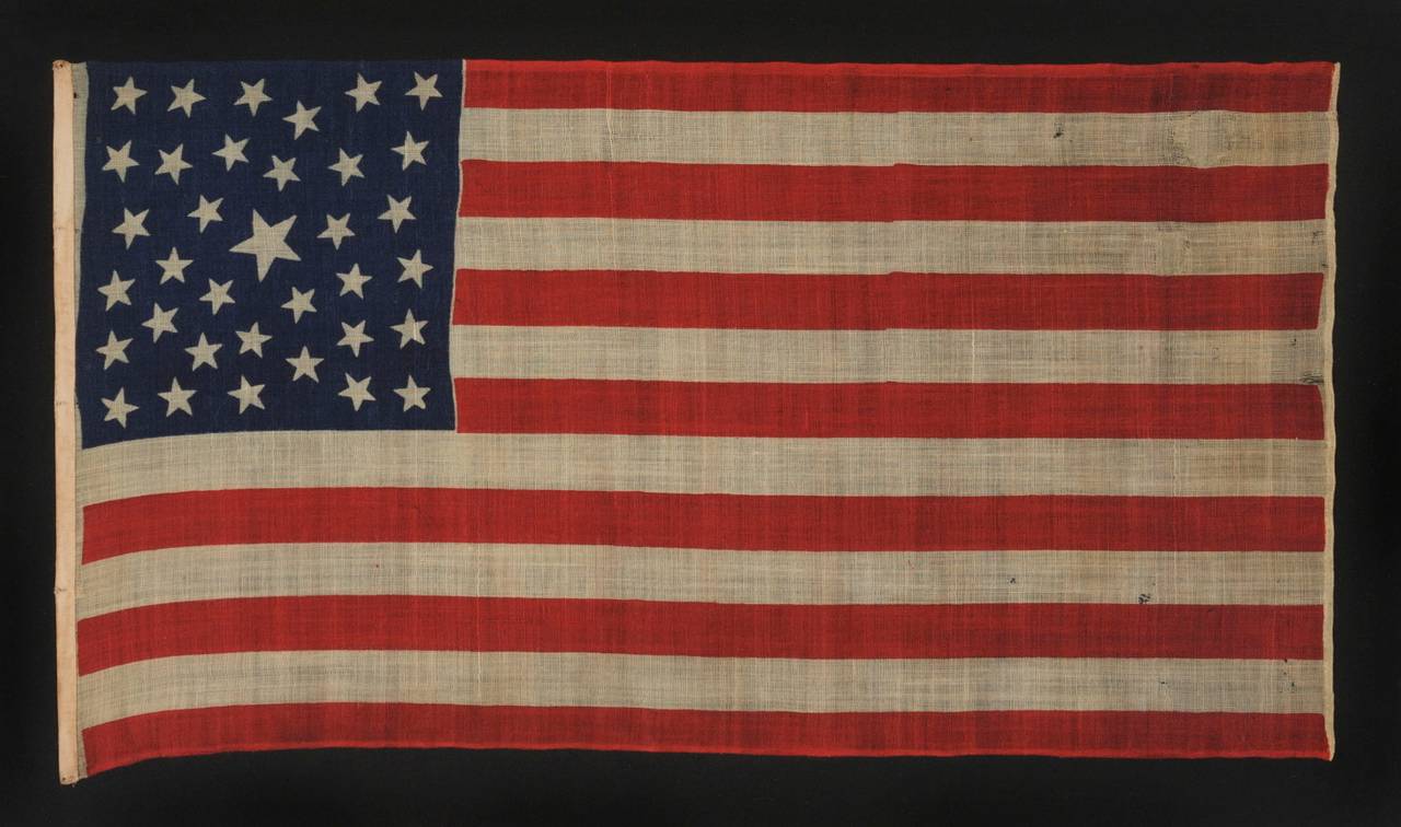 35 STARS, PROBABLY A CIVIL WAR CAMP COLORS, WEST VIRGINIA STATEHOOD, 1863-1865, ONE OF A TINY HANDFUL OF PRESS-DYED WOOL FLAGS WITH A RANDOM CONFIGURATION OF STARS:

 35 star American national flag, press-dyed on wool bunting, with a plain weave