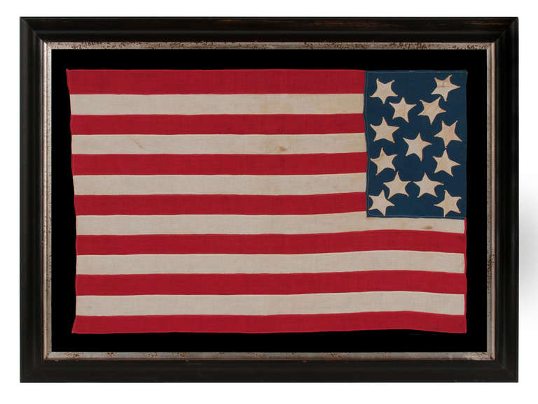 13 WHIMSICAL STARS IN A TALL AND NARROW CANTON, ON A HOMEMADE FLAG WITH OUTSTANDING FOLK PRESENTATION, MADE AROUND THE TIME OF THE 1876 CENTENNIAL:

 13 star American national flag, homemade and with some exceptional folk qualities. Chief among
