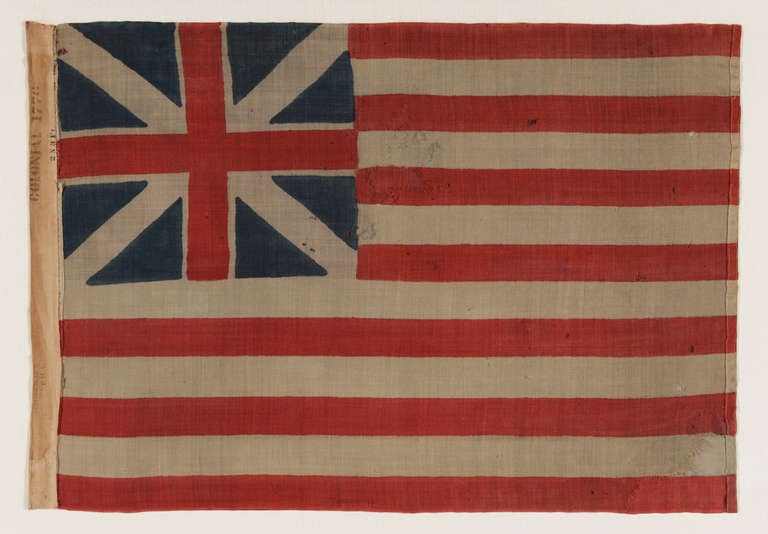 ANTIQUE, 1876 EXAMPLE OF THE FIRST NATIONAL FLAG OF AMERICA, THE “GRAND UNION”, SOLD BY HORSTMANN BROS. & CO. OF PHILADELPHIA FOR THE 1876 CENTENNIAL INTERNATIONAL EXHIBITION; THE ONLY ONE OF ITS KIND AND ONE OF ONLY A TINY HANDFUL THAT SURVIVE FROM