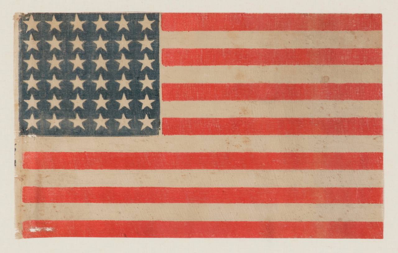 36 STARS ON A CIVIL WAR ERA PARADE FLAG, 1864-67, NEVADA STATEHOOD:

36 star American national flag of the Civil War era, printed on coarse, glazed cotton. Lincoln pushed Nevada through to statehood on October 31st, 1864, during the Civil War, and