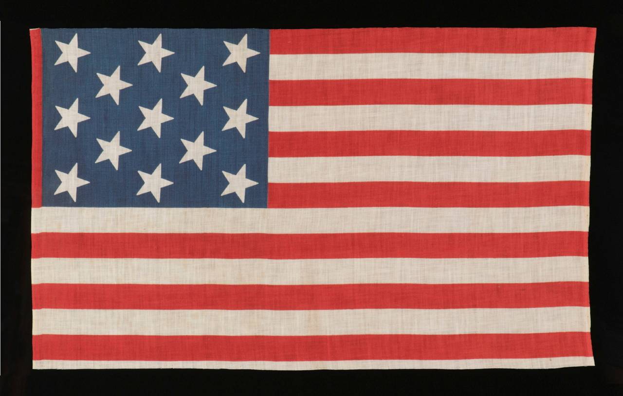 13 Stars, 1876-1898, a Very Rare Printed Example, Unusually Large Among its Known Counterparts of the Late 19th Century:

13 star American national parade flag, printed on cotton, made sometime in the period between 1876 and 1898. This is a very
