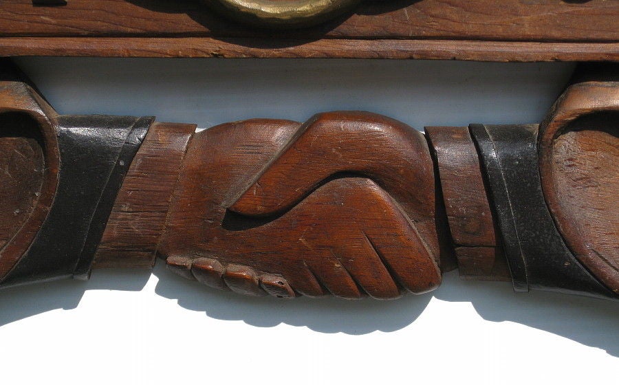 EAGLE CARVING WITH CLASPED HANDS, ODD FELLOWS FRATERNAL LODGE, CIRCA 1890-1910:<br />
<br />
Carved eagle with crossed flags, clasped hands, and the three-link chain of the Odd Fellows fraternal lodge (which stand for friendship, hope, and truth).