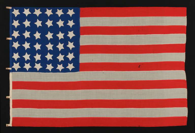 36 STARS ON A BRIGHT BLUE CANTON, CIVIL WAR ERA, 1864-1867, NEVADA STATEHOOD, A GREAT FOLK EXAMPLE:

36 star American national flag of the Civil War era with a host of desirable features.  Entirely hand-sewn and made of fine merino wool, the most