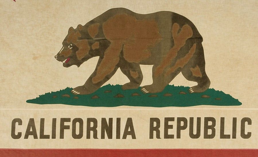 CALIFORNIA STATE FLAG, 1940-1950, A LARGE EXAMPLE WITH ATTRACTIVE WEAR FROM EXTENDED USE:<br />
<br />
19th century state flags fall between very scarce and extraordinarily rare in the antiques marketplace. One primary reason for this is that most