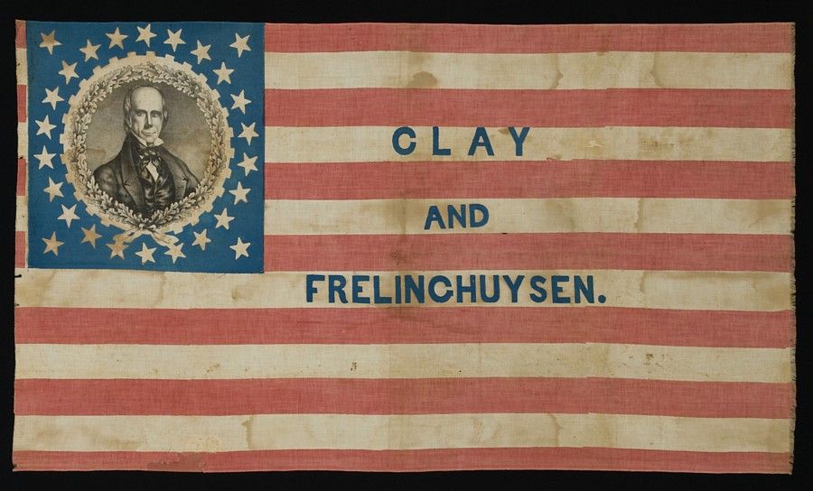 EXTREMELY RARE HENRY CLAY CAMPAIGN PARADE FLAG WITH PORTRAIT IN OAK LEAF & GEAR COG MEDALLION, 26 STARS, 1844:<br />
<br />
26 star American parade flag, printed on cotton, made for the 1844 campaign of Henry Clay. Clay’s portrait appears inside a