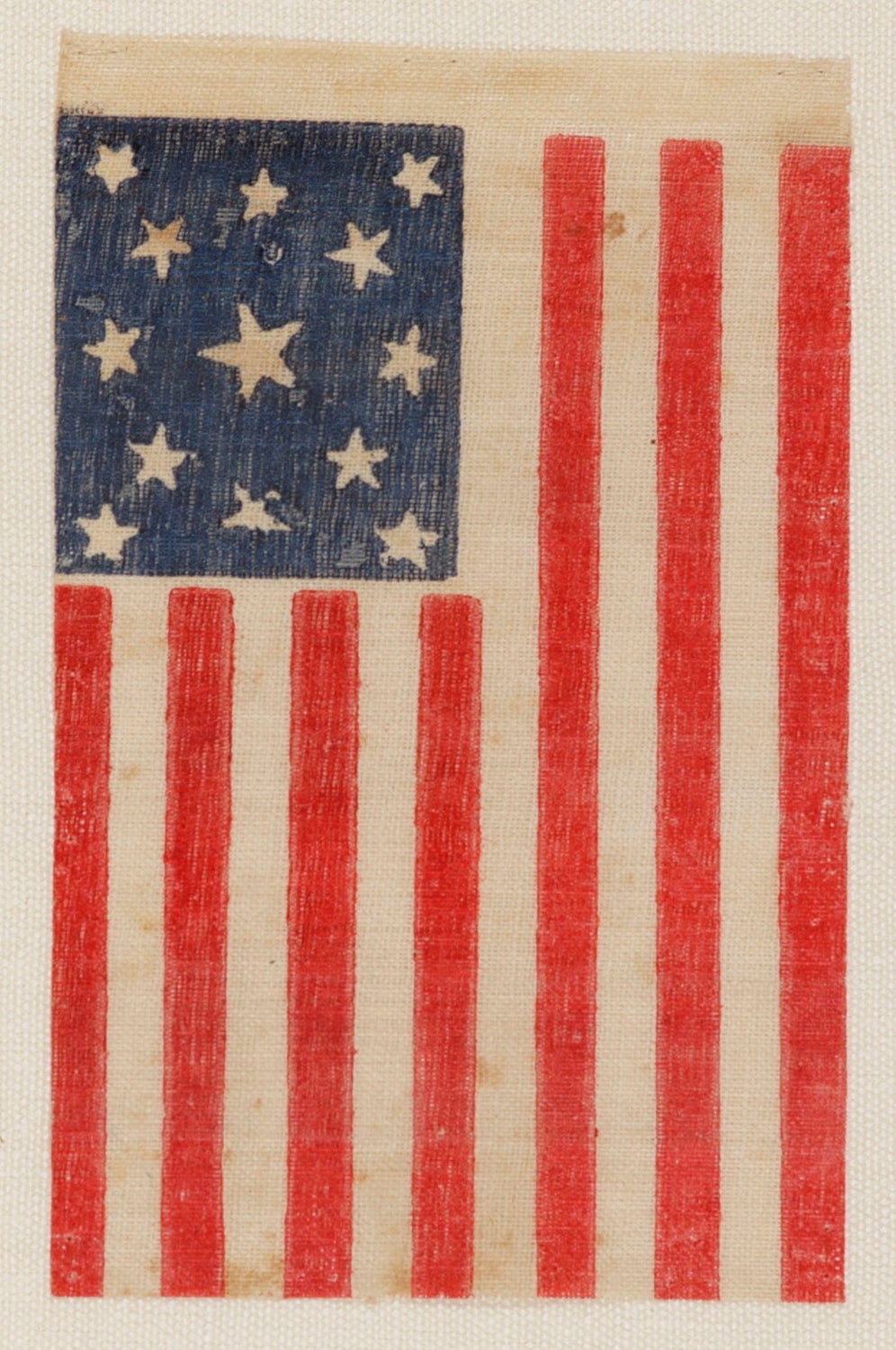 13 stars in a medallion configuration on a large-scale parade flag made for the 1876 centennial:

 13 star American national parade flag, printed on coarse, glazed cotton, made for the 1876 celebration of our nation’s 100-year anniversary of