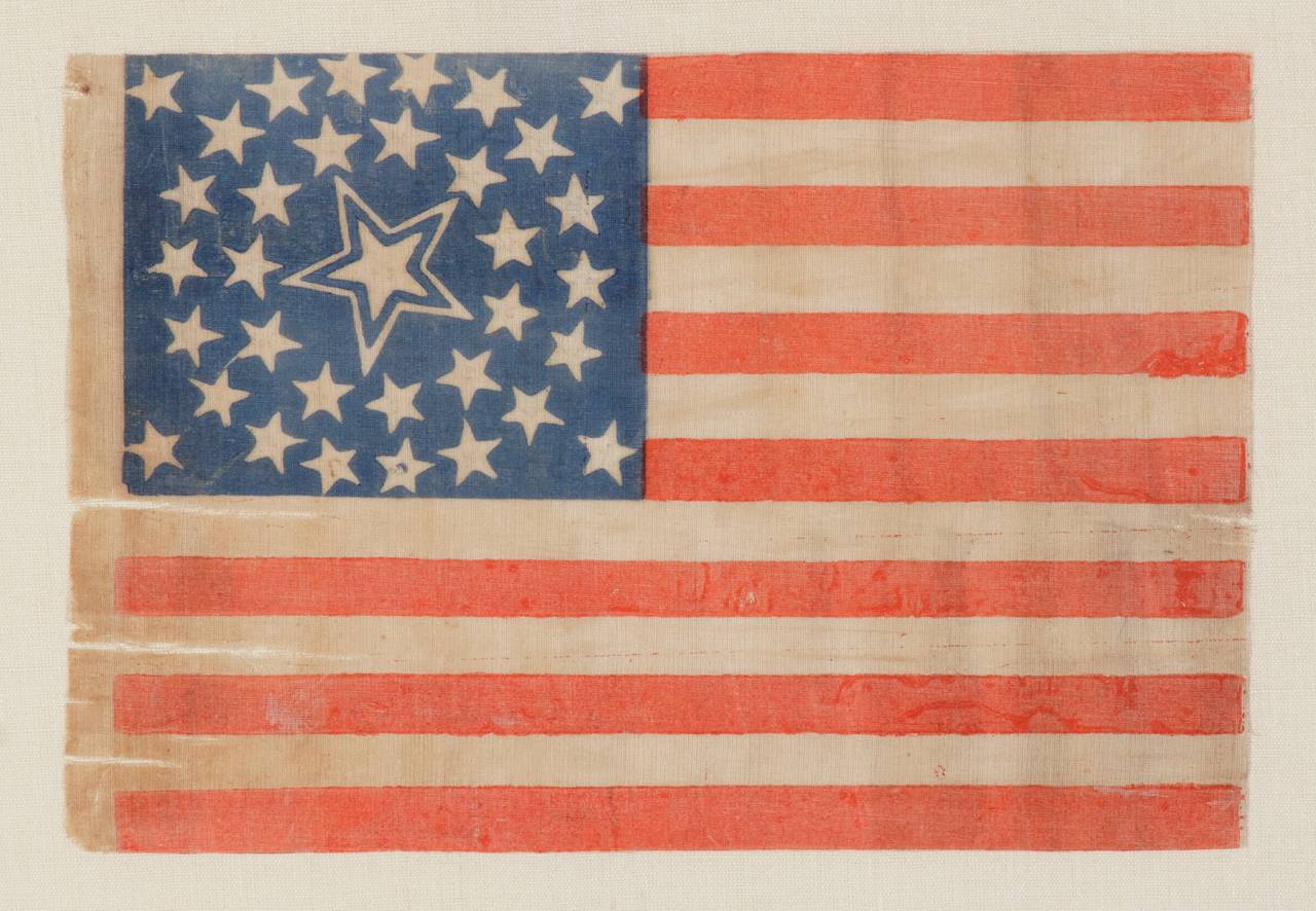 34 stars in a medallion configuration with a large, haloed center star, Civil War period, 1861-63, Kansas statehood:

 34 star American national parade flag, printed on cotton and bearing a beautiful medallion configuration that has a large,