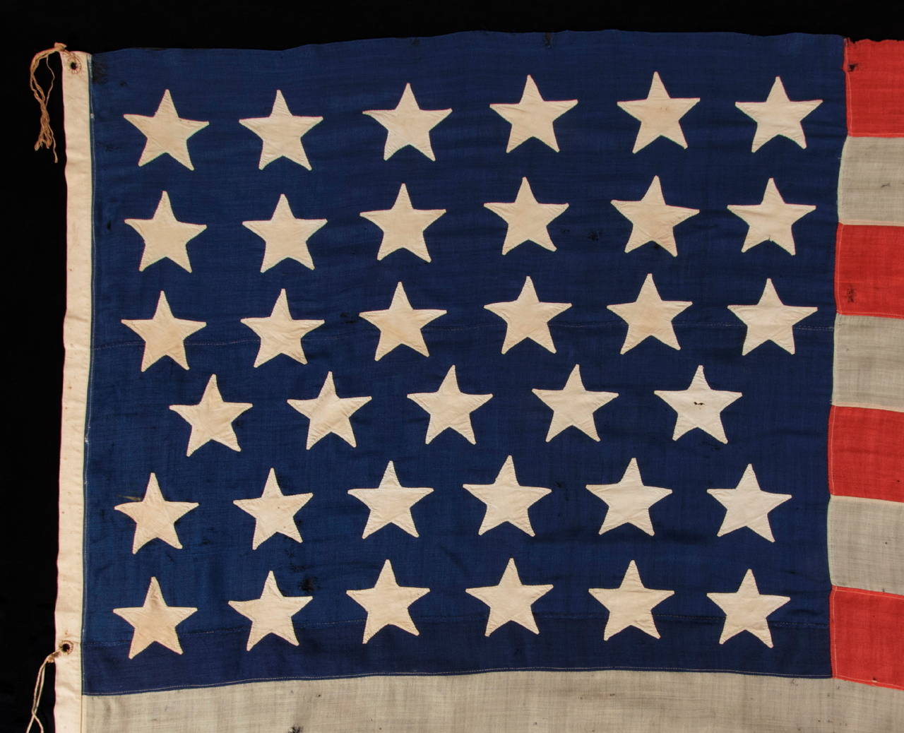 35 SINGLE-APPLIQUÉD STARS ON A CIVIL WAR PERIOD FLAG, SIGNED BY A SURGEON FROM SARATOGA SPRINGS, NEW YORK WHO SERVED WITH THE 29TH NEW YORK STATE MILITIA, WHICH MUSTERED OUT ON JUNE 20TH, 1863, THE EXACT DAY UPON WHICH WEST VIRGINIA BECAME THE 35TH