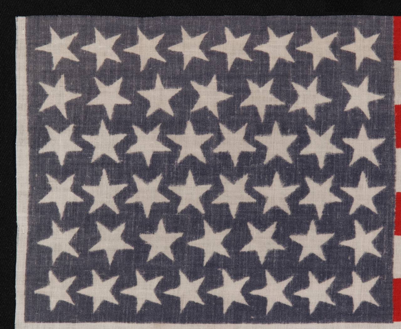 46 stars with varied star positioning, 1907-1912, Oklahoma statehood:

 46 star American national parade flag, printed on plain weave cotton. The stars of the flag are configured in staggered rows of 8-7-8-8-7-8, which is typical of this star