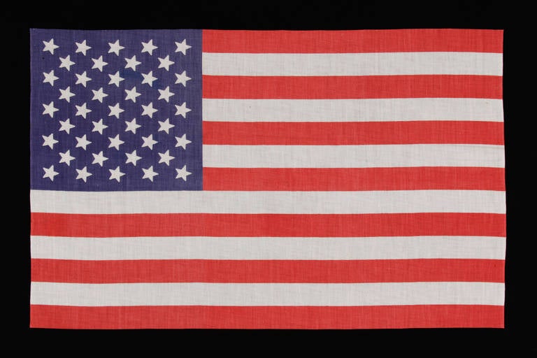 41 star American national parade flag, printed on cotton. 41 was never an official star count. There were many flags produced with unofficial star counts, but this one was accurate for just three days and is extremely rare.

 On November 2nd of