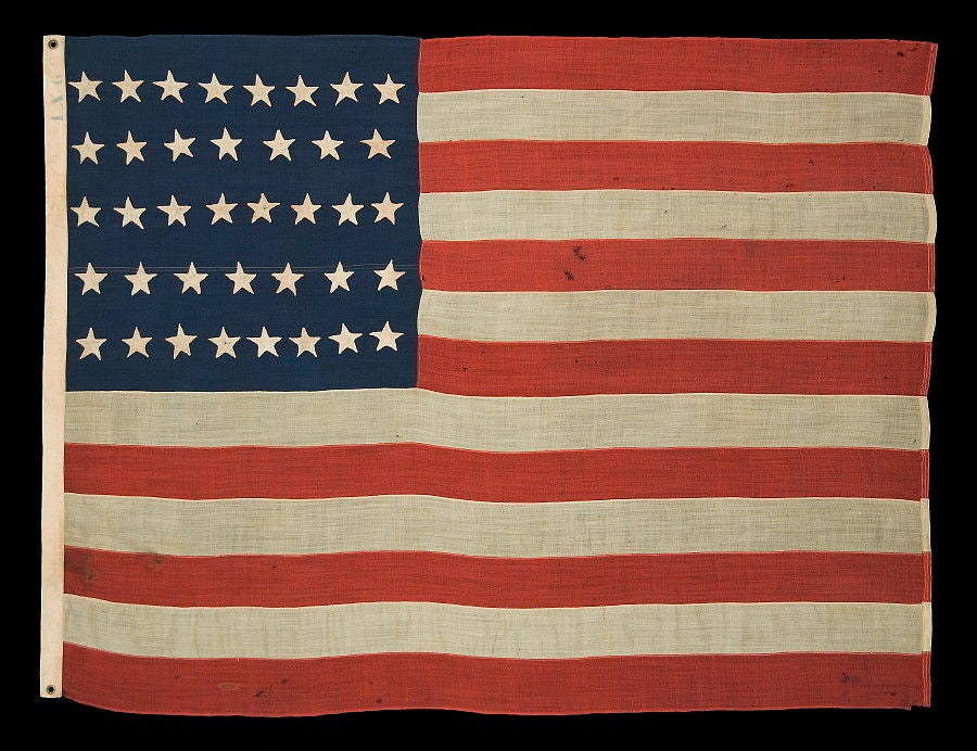 38 HAND-SEWN, SINGLE-APPLIQUÉD STARS, A RARE SMALL SIZE FOR THE PERIOD, 1876-1889, COLORADO STATEHOOD:<br />
<br />
38 star American National flag in a rare, small size for the period (1876-1889). The stars are made of cotton, hand-sewn, and