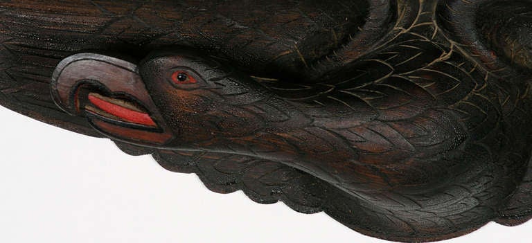 LATE 19TH CENTURY CARVING OF AN EAGLE WITH OLD, BLACK VARNISHED SURFACE, IN A DESIRABLE SCALE:

 Carved wooden eagle, American, ca 1885, in a both form and with an old varnished surface that has blackened and separated with age to a very