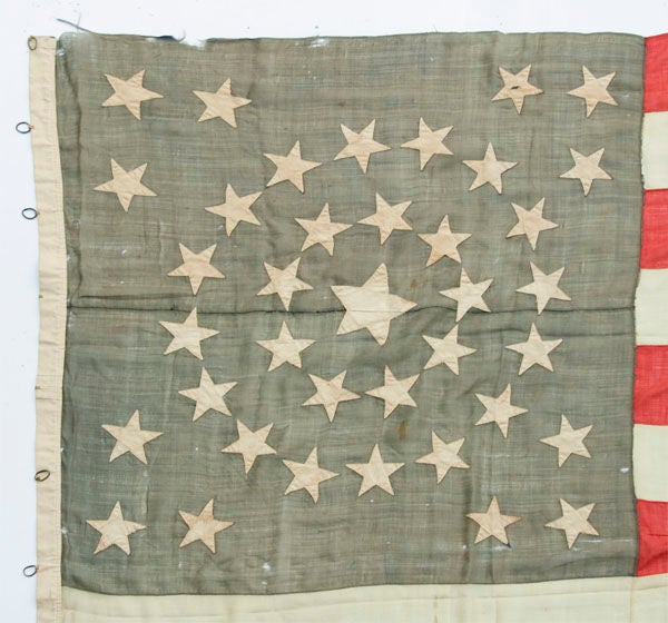 38 STARS IN A MEDALLION CONFIGURATION WITH A RARE GROUPING OF 3 STARS IN EACH CORNER, 1876-1889, COLORADO STATEHOOD:<br />
<br />
38 star American national flag in a large size with some unusual and attractive features. The stars are arranged in a