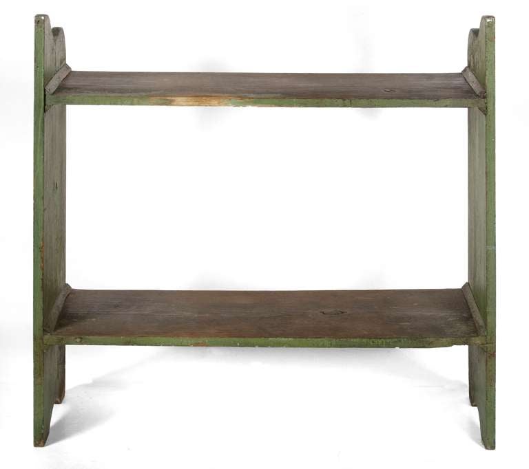 PENNSYLVANIA BUCKET BENCH IN APPLE GREEN PAINT, 1820-1865:

Among surviving Pennsylvania bucket benches, this is a gem. The simple form features plank sides with serpentine scrollwork at the top over half-moon, bootjack feet. There are two