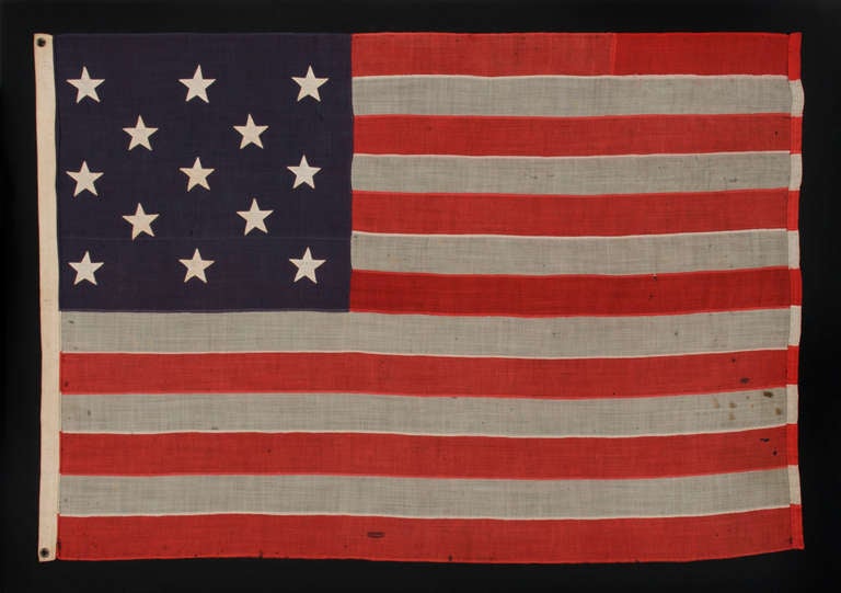 13 STARS IN A 3-2-3-2-3 CONFIGURATION, AN ATTRACTIVE FLAG IN A SMALL SCALE WITH PLEASING PROPORTIONS, MADE BETWEEN 1876 AND THE 1890's:

 13 star American national flag, probably dating to the last decade of the 19th century, though perhaps