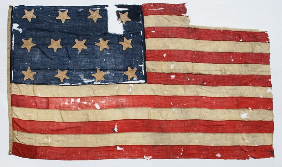 13 STAR FLAG OF THE 1820-1840 PERIOD OR PRIOR, AN EXTRAORDINARILY EARLY SURVIVOR AMONG ANTIQUE STARS & STRIPES, FORMERLY HAVING ACCOMPANIED THE FAMOUS 