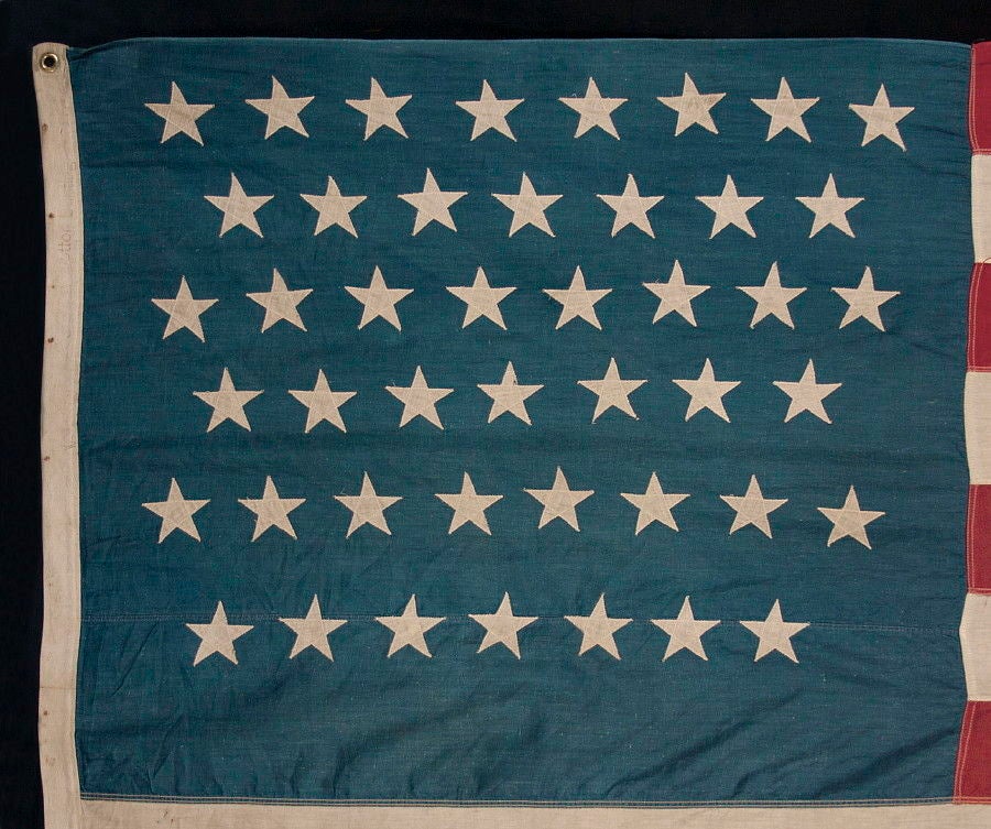 45 STARS ON AN ESPECIALLY ATTRACTIVE DENIM BLUE CANTON, A BEAUTIFUL EXAMPLE OF A COTTON BUNTING FLAG OF THIS PERIOD, 1896-1907, SPANISH-AMERICAN WAR ERA, UTAH STATEHOOD:<br />
<br />
45 star American national flag with especially nice colors and