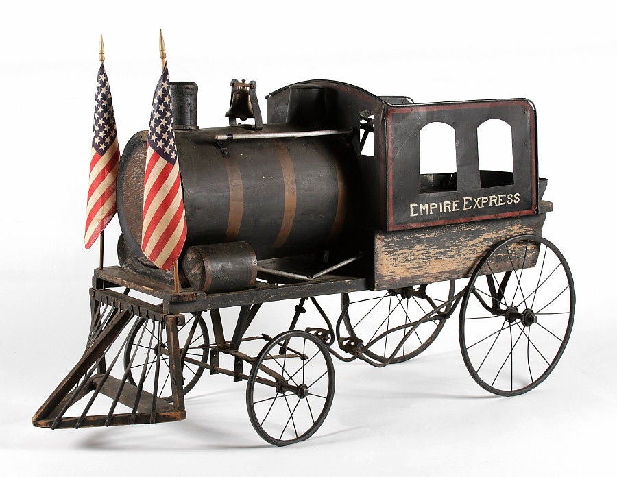 FANTASTIC AMERICAN LOCOMOTIVE PEDAL VEHICLE, WITH GREAT FOLK QUALITIES, MADE IN THE FORM OF THE FAMOUS NEW YORK EMPIRE EXPRESS, CA 1920:<br />
<br />
The Empire State Express was a world famous locomotive and the 1890's flagship of the New York