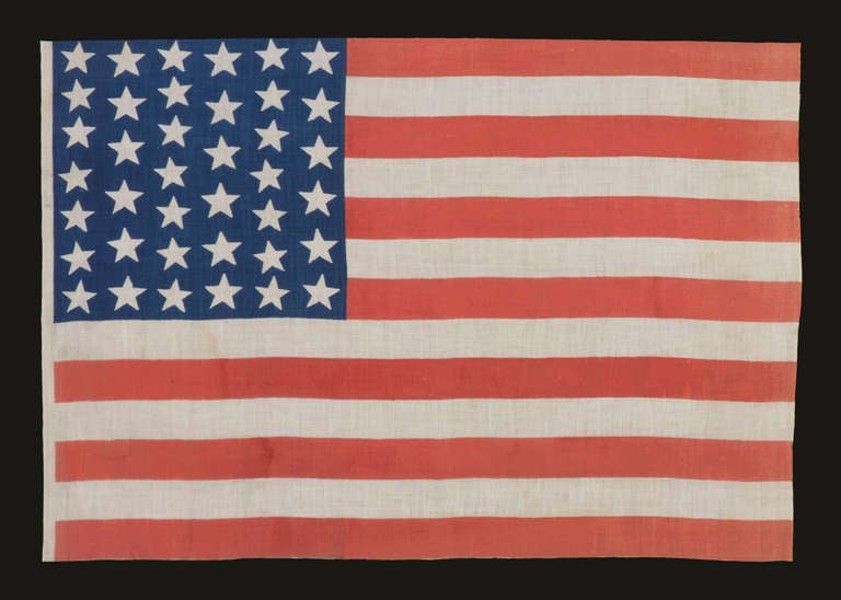 39 STARS IN TWO SIZES, ALTERNATING FROM ONE COLUMN TO THE NEXT, NEVER AN OFFICIAL STAR COUNT, 1875-76:

 39 star American parade flag, printed on cotton bunting. This is one of only three styles known that use stars in two different sizes to make