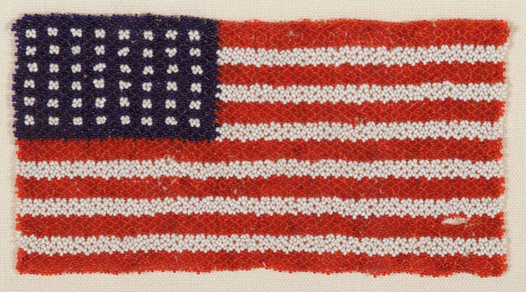 48 STAR BEADWORK AMERICAN FLAG, CA 1912-1920:

 While many Native American beaded items include the American national flag within their imagery, flags made entirely of beadwork are especially scarce. I have seen but a small handful over the years.