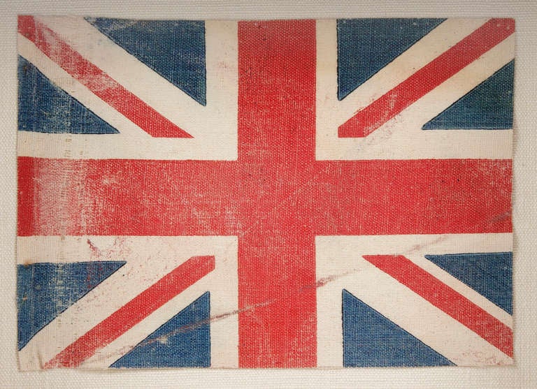 BRITISH UNION JACK PARADE FLAG, 1890-1920:

Small British Union Jack parade flag, printed on oilcloth cotton, made sometime between 1900 and the 1930's. The most likely purpose would be for WWI (U.K. involvement 1914-1918) patriotism or for use at